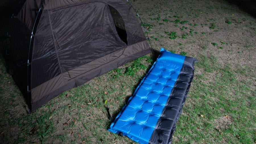 blue air mattress outside tent