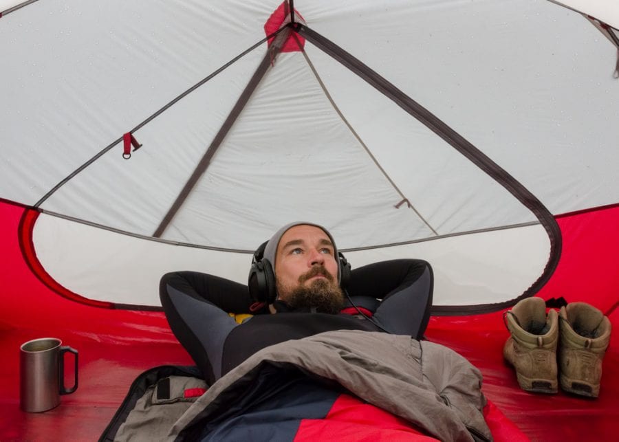 Man Sleeping inside Tent